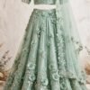 Mint green organza mehndi lehenga with 3D floral embroidery, bell-sleeve choli and floral organza dupatta by NoorNoorani