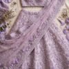 Pastel lavender organza engagement lehenga with thread embroidery, mirror work and puff-sleeve choli by NoorNoorani